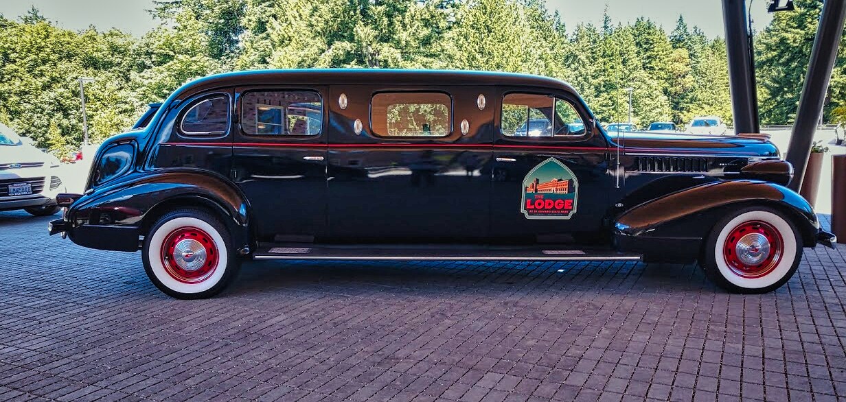 Old limo with the Lodge logo on the front door