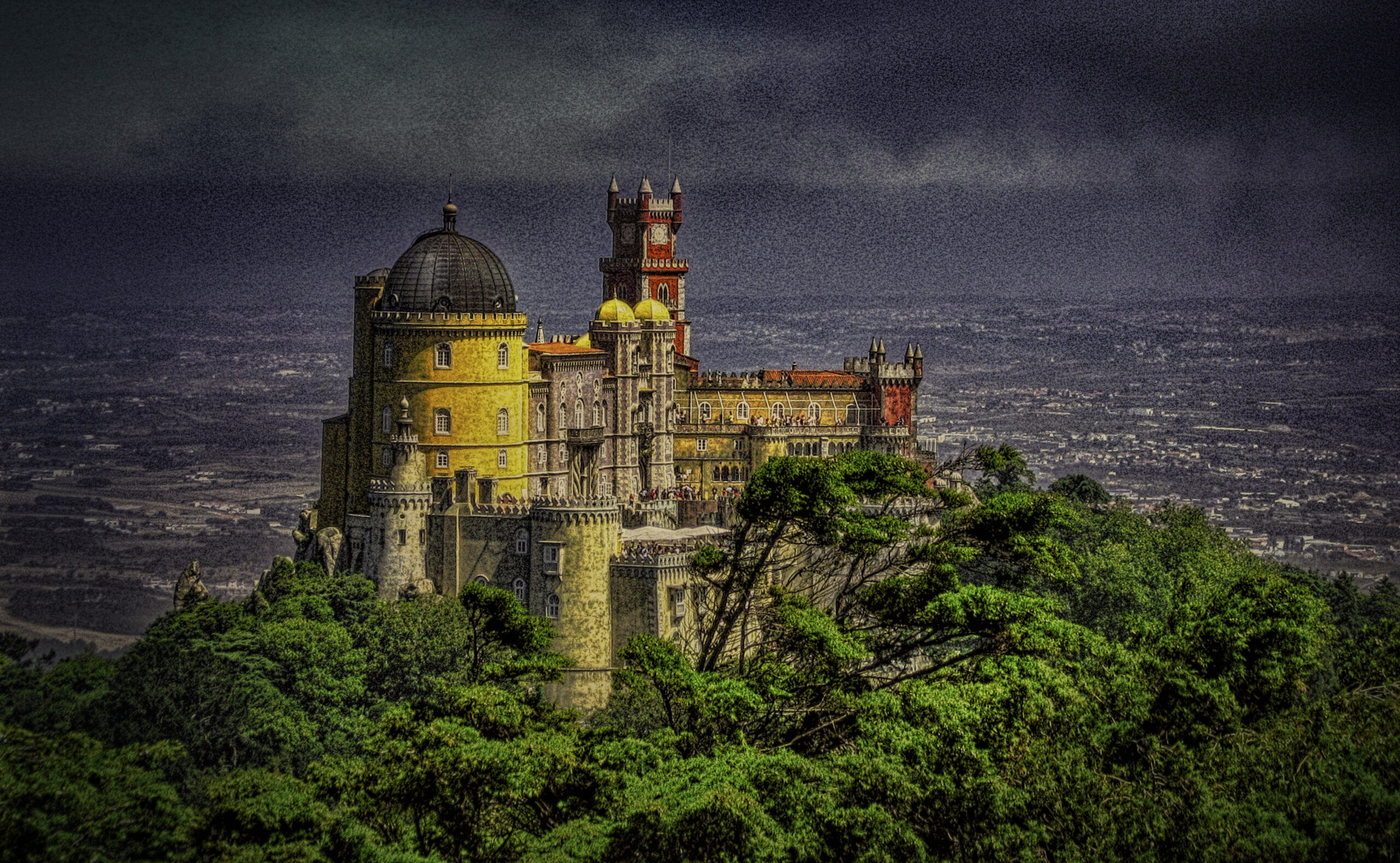 Large castle on a hilltop in Sintra, Portuga;