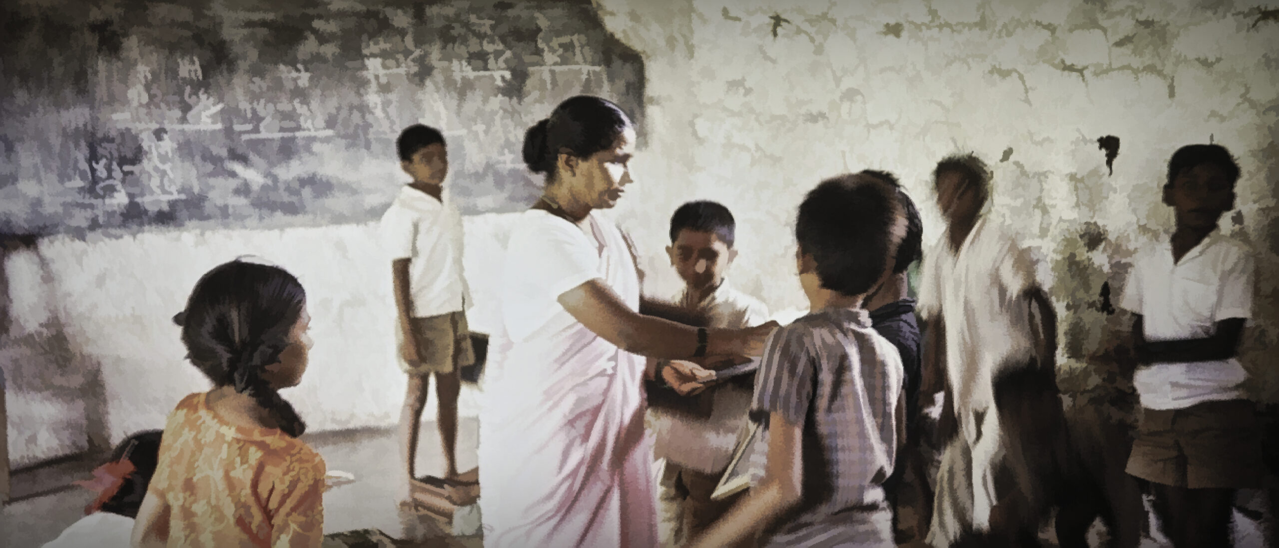 A female teacher with students in India