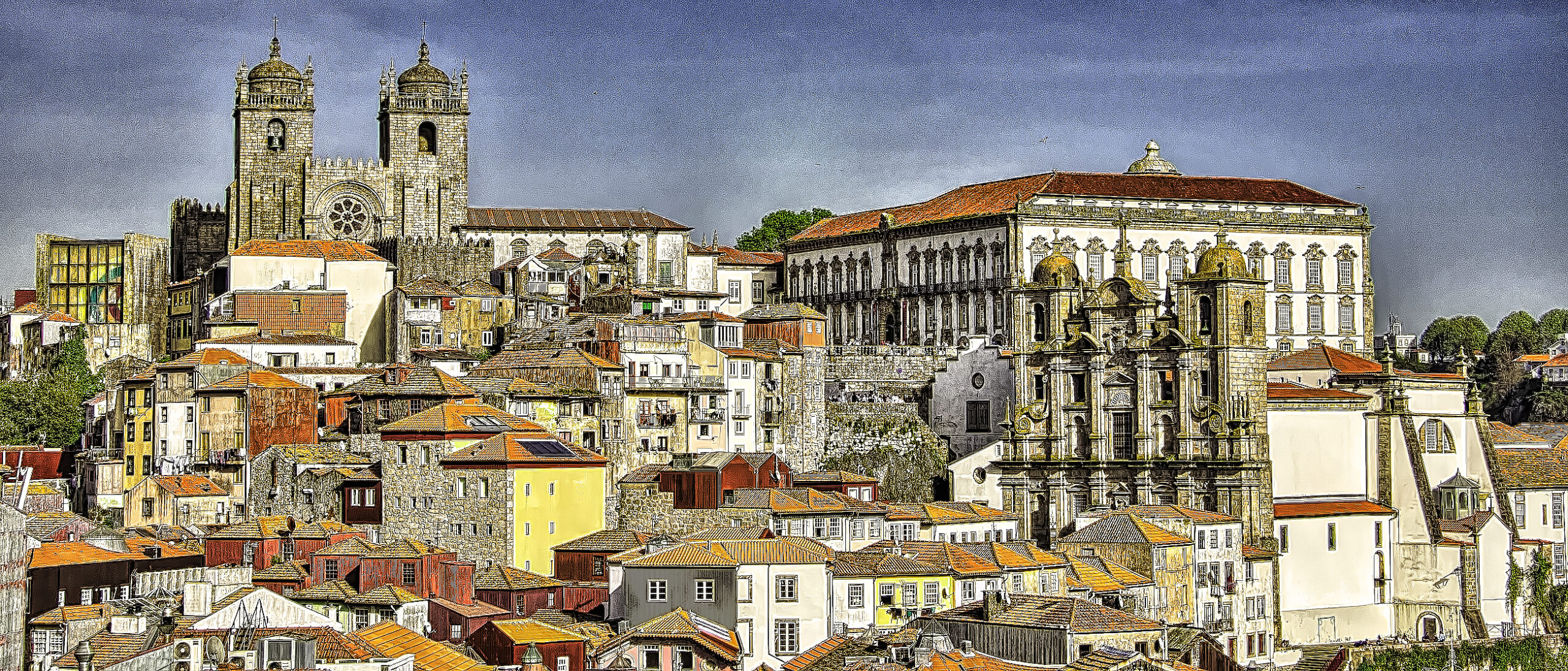 A view of two cathedrals over the city rooftops in Porto, Portugal
