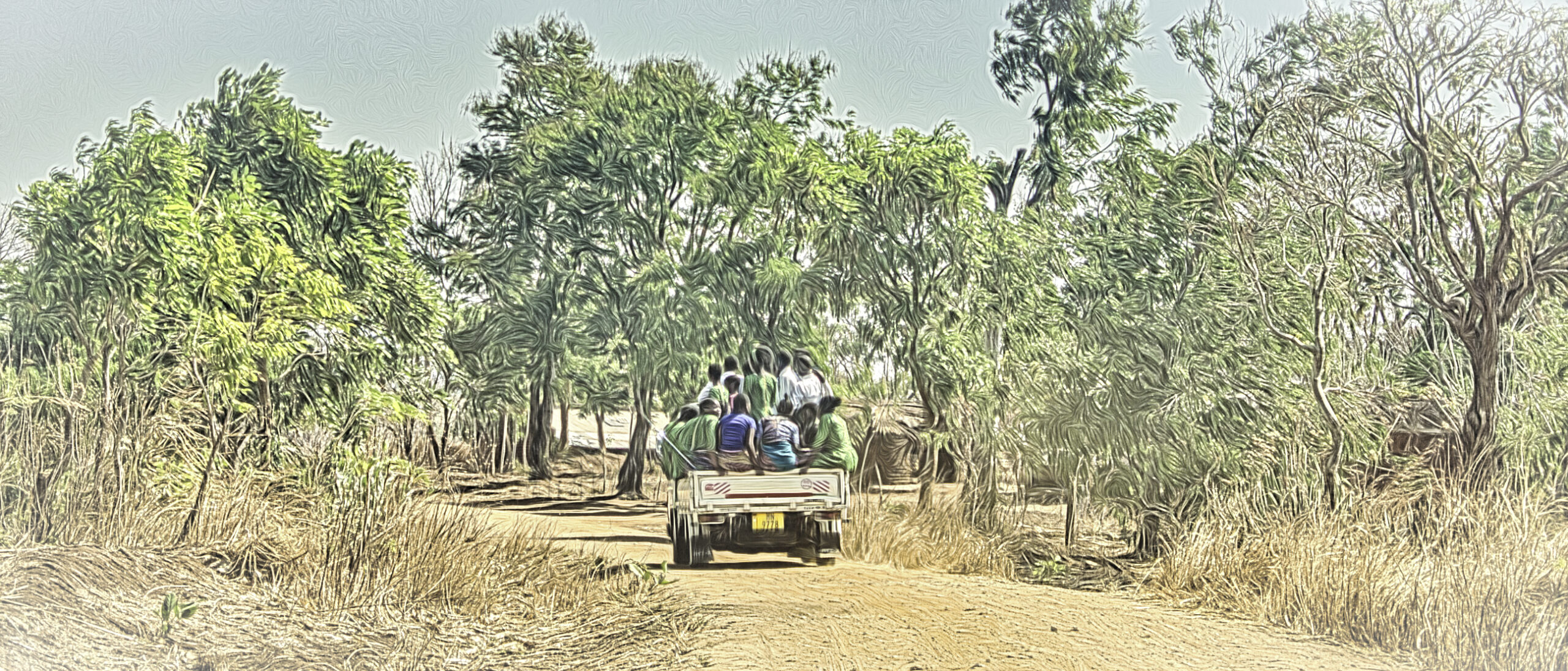 White pickup carrying worshipers home from church in Malawi