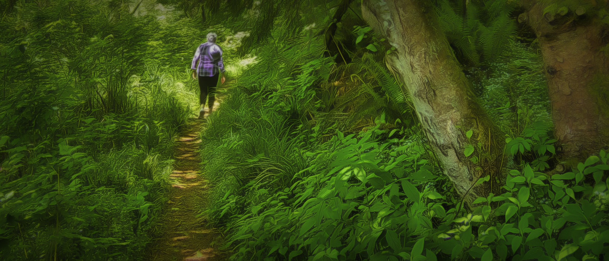 Women walking a narrow trail at Nestucca National Wildlife Refuge south of Tillamook, Oregon