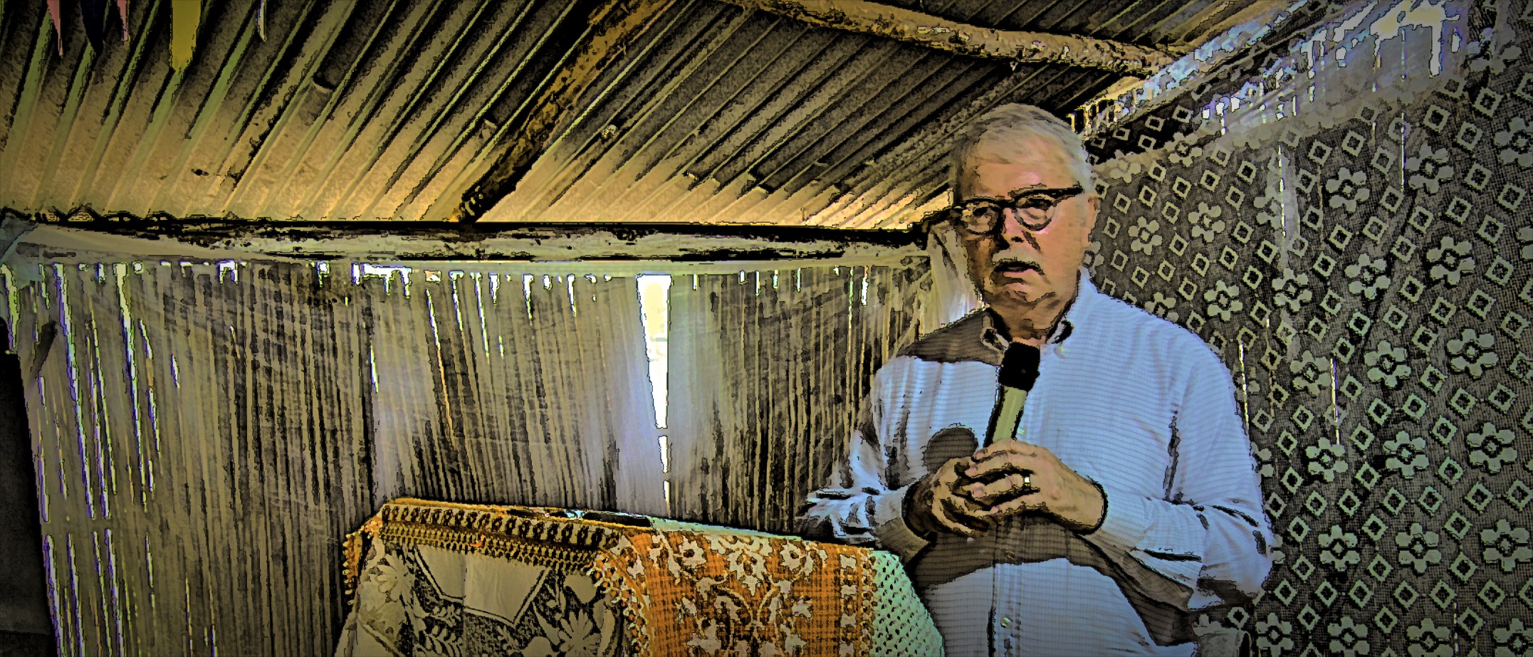 Man speaking with a microphone in a church in Togo, Africa