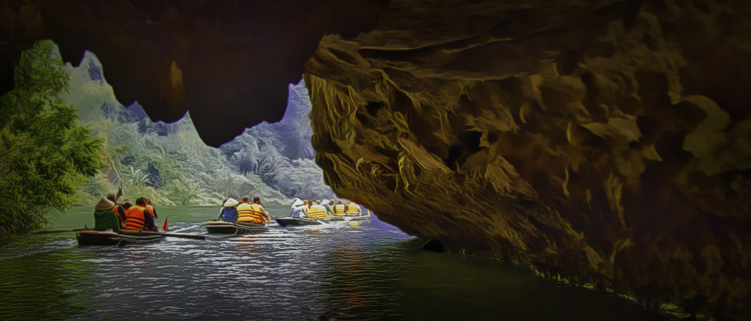 Boats coming out o a cave near Ninh Binh, Vietnam