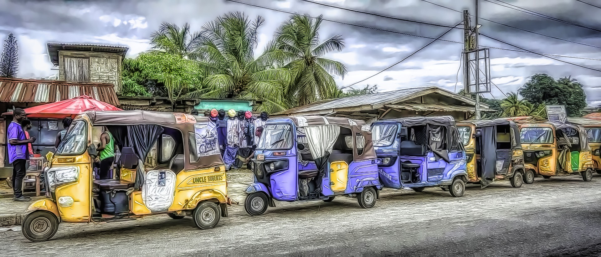 Kekehs lined up waiting for passengers in Monrovia, Liberia