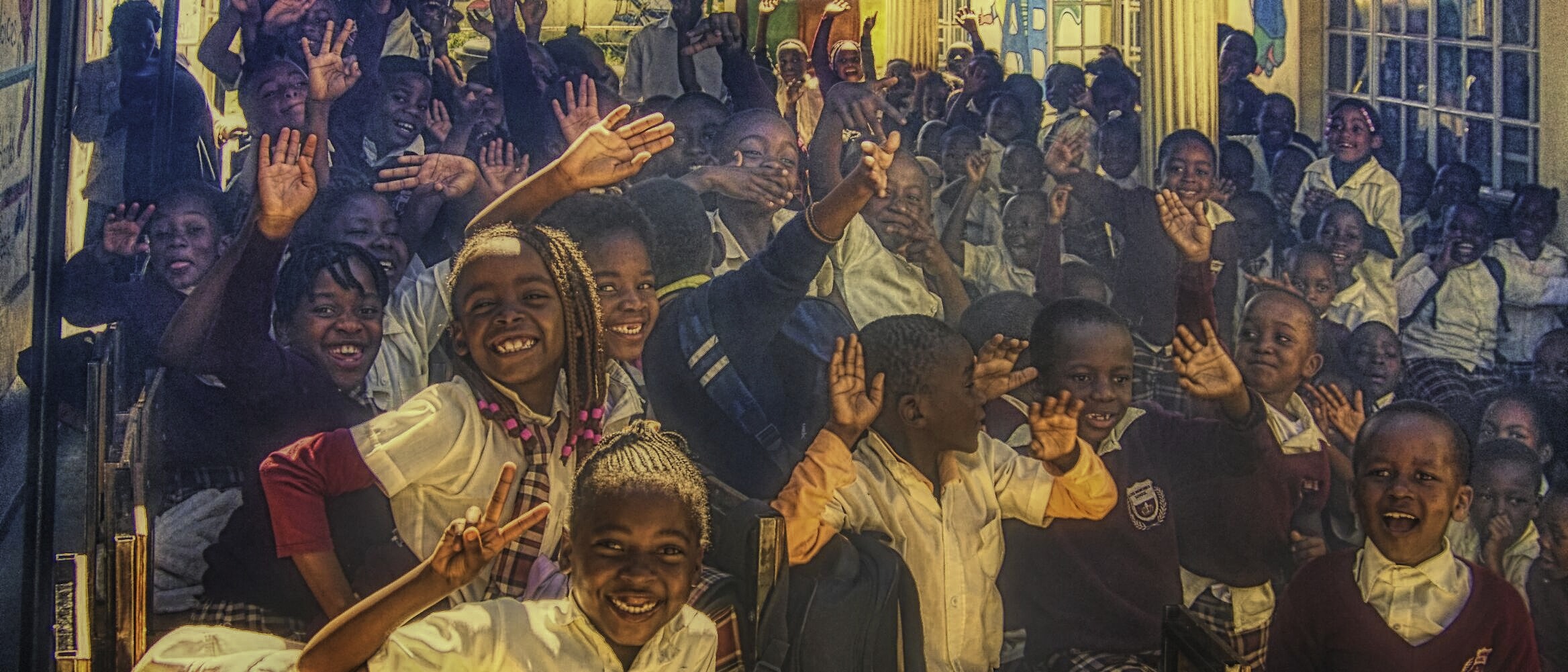Students excited to see guests at a school in Malawi
